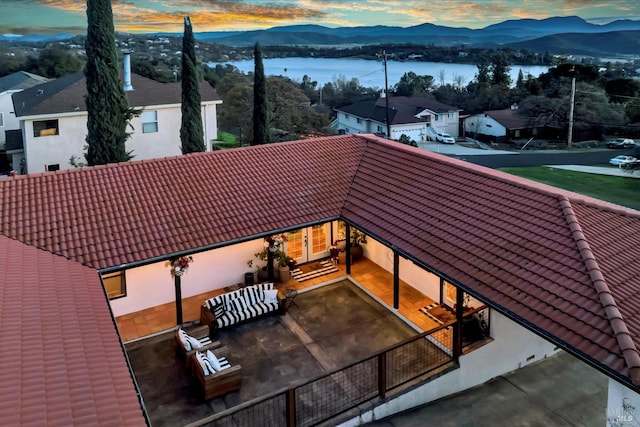 exterior space with a water and mountain view