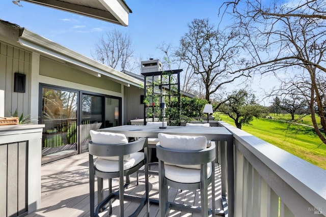 wooden deck with outdoor dining space