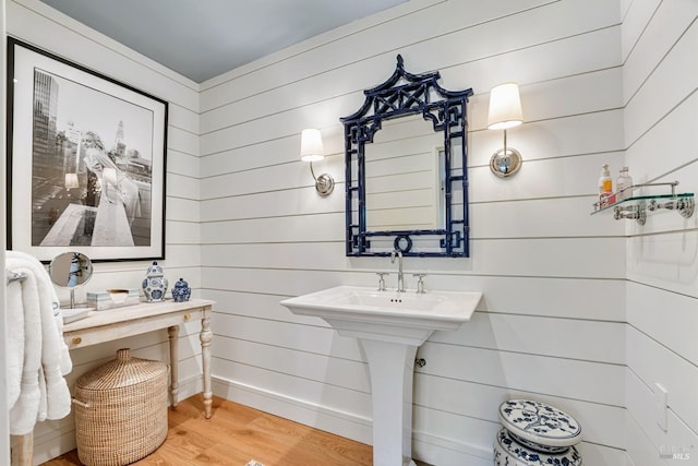 bathroom featuring baseboards and wood finished floors