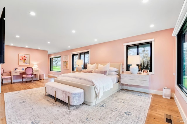 bedroom with visible vents, recessed lighting, light wood-type flooring, and baseboards