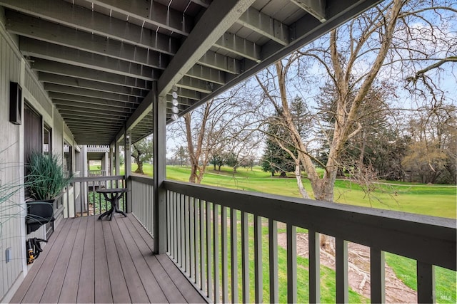 wooden terrace with a yard