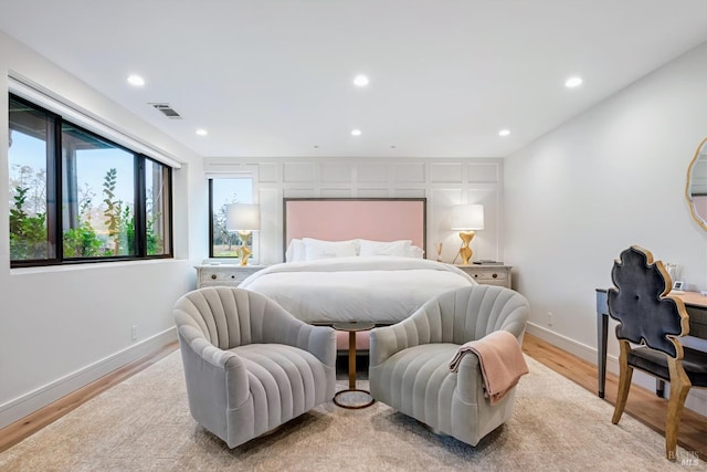 bedroom featuring visible vents, recessed lighting, light wood-type flooring, and baseboards