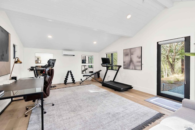 interior space featuring baseboards, lofted ceiling, a wall unit AC, recessed lighting, and light wood-style floors