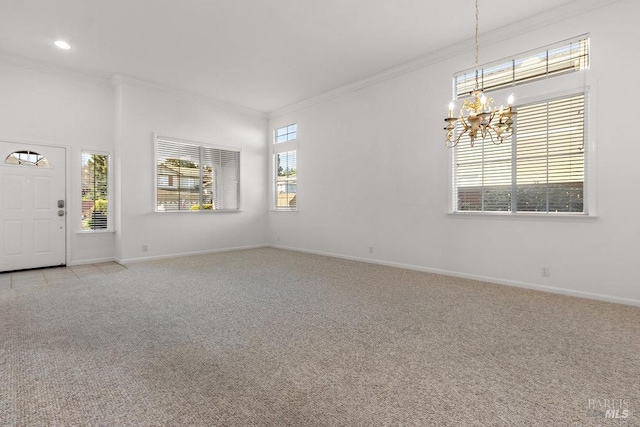 interior space with baseboards, light colored carpet, a chandelier, and crown molding