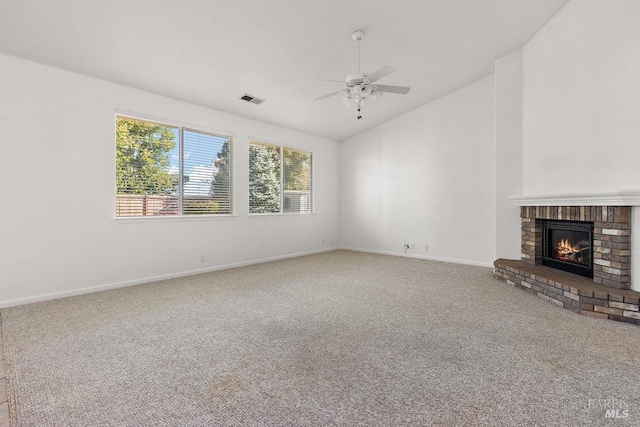 unfurnished living room with visible vents, a ceiling fan, carpet floors, a fireplace, and baseboards