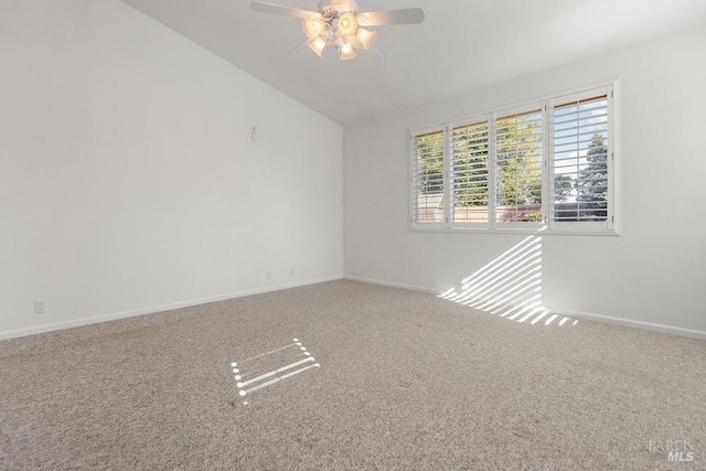 unfurnished room with lofted ceiling, carpet, baseboards, and ceiling fan