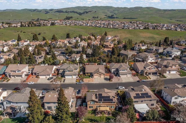 birds eye view of property with a mountain view and a residential view