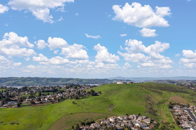 birds eye view of property featuring a mountain view