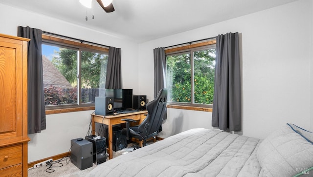 bedroom featuring ceiling fan and baseboards