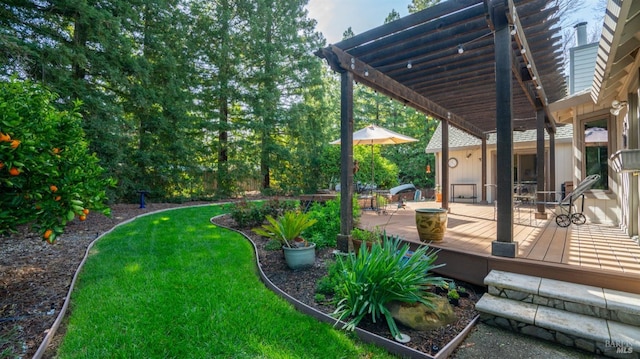 view of yard with a deck and a pergola