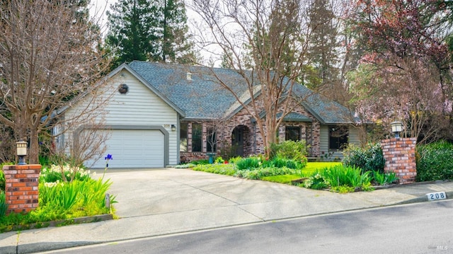 view of front of property with driveway and a garage