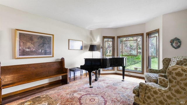 sitting room with wood finished floors and baseboards