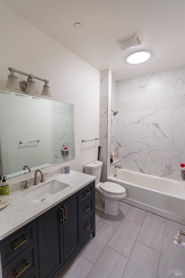 full bath with visible vents, toilet, vanity, and washtub / shower combination