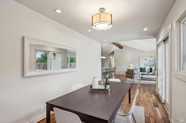 dining area featuring dark wood-style floors, visible vents, recessed lighting, and vaulted ceiling