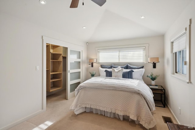 bedroom featuring a ceiling fan, baseboards, lofted ceiling, recessed lighting, and light colored carpet