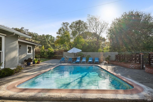 view of pool featuring a fenced in pool, a patio, and fence