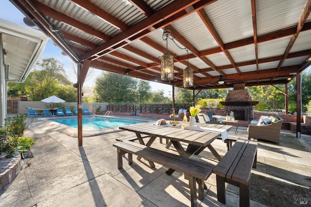 view of pool featuring a patio area, an outdoor living space with a fireplace, a fenced in pool, and a fenced backyard