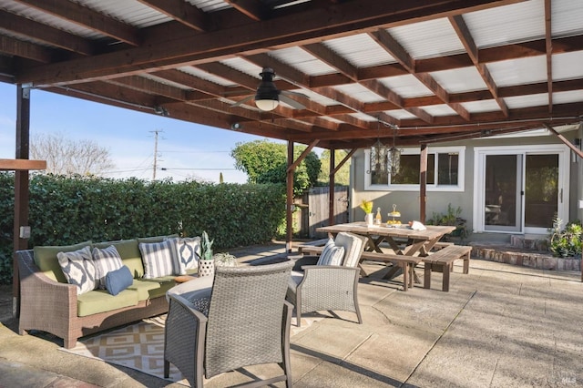 view of patio / terrace with ceiling fan, an outdoor hangout area, and outdoor dining space