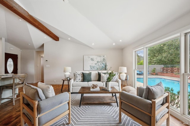 living room with recessed lighting, lofted ceiling with beams, baseboards, and wood finished floors