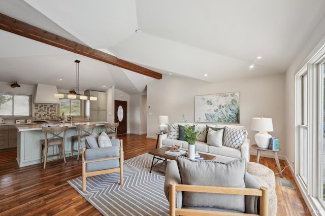 living room featuring visible vents, lofted ceiling with beams, and dark wood-type flooring