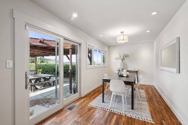 office space with visible vents, recessed lighting, baseboards, and wood-type flooring