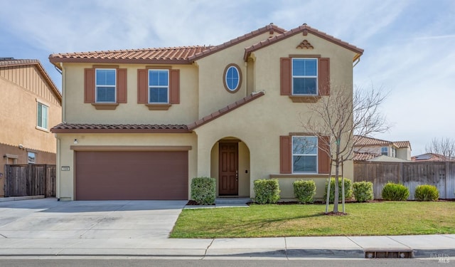 mediterranean / spanish-style home featuring stucco siding, a front lawn, driveway, fence, and a tiled roof