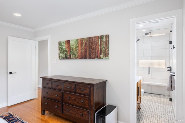 bedroom featuring baseboards, light wood-style flooring, recessed lighting, ornamental molding, and connected bathroom