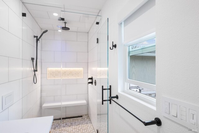 bathroom with a shower stall