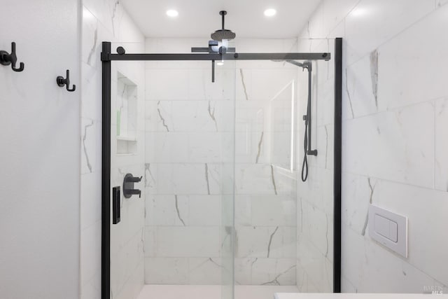 full bath featuring recessed lighting and a shower stall