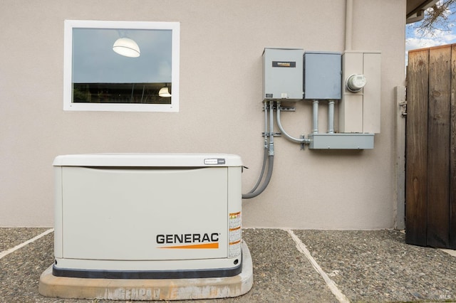 exterior details featuring stucco siding, a power unit, and fence