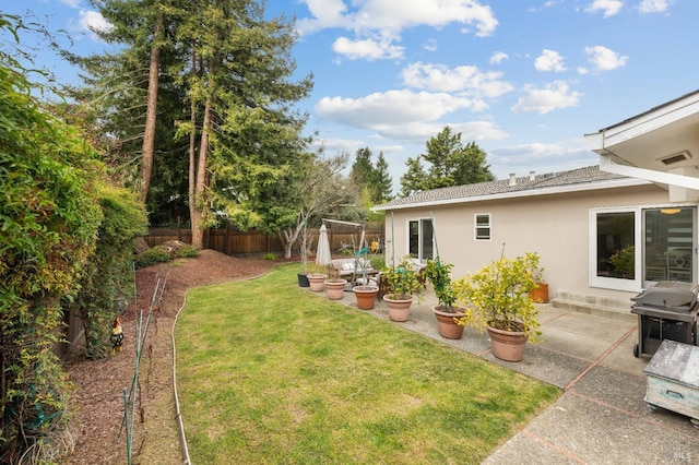 view of yard featuring a patio area and fence