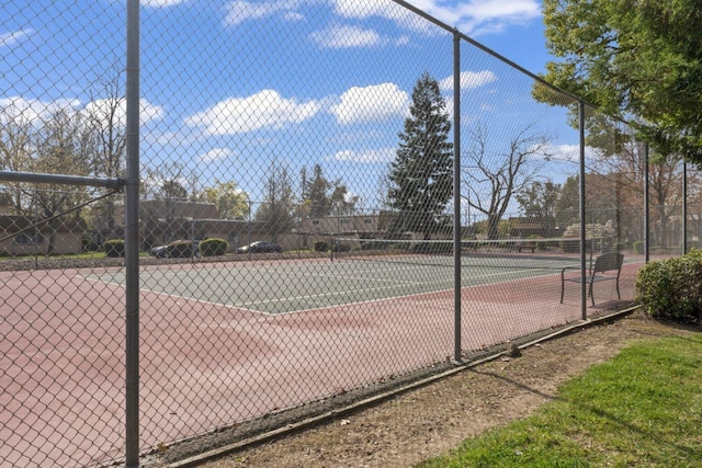 view of sport court with fence