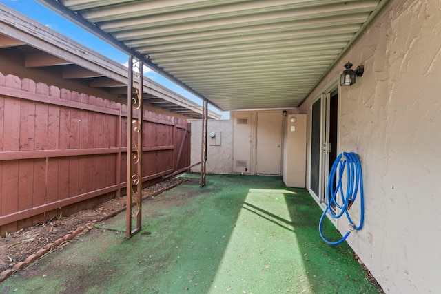 view of patio featuring fence