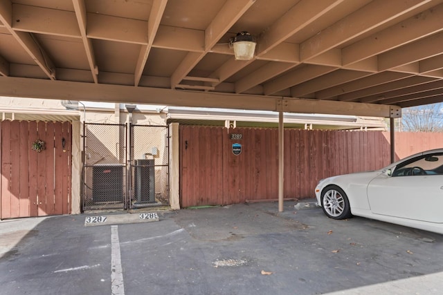 covered parking lot with a gate and fence