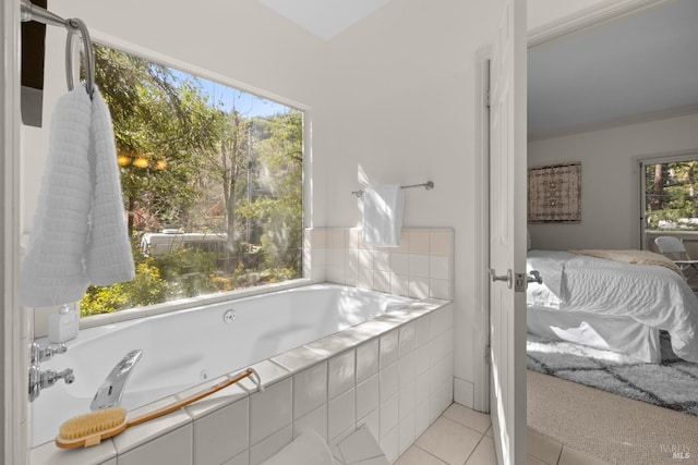 bathroom with tile patterned flooring, ensuite bath, and a jetted tub