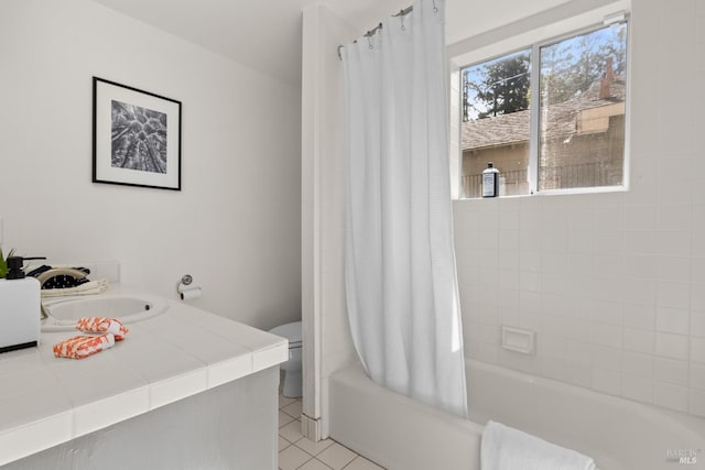 bathroom featuring shower / bath combo with shower curtain, toilet, vanity, and tile patterned flooring