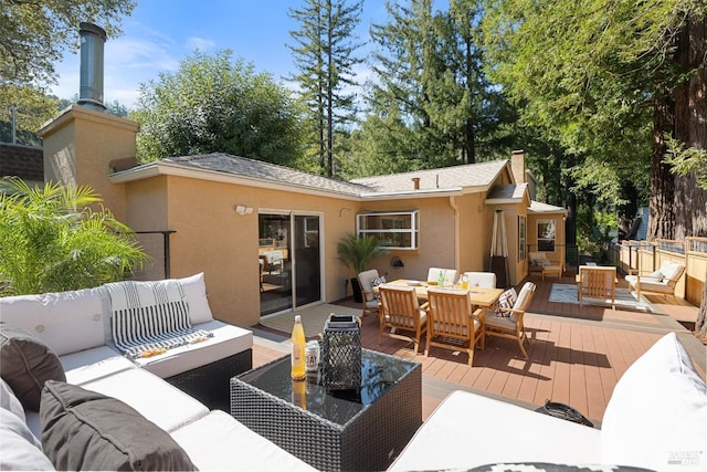 exterior space featuring outdoor dining space and an outdoor hangout area