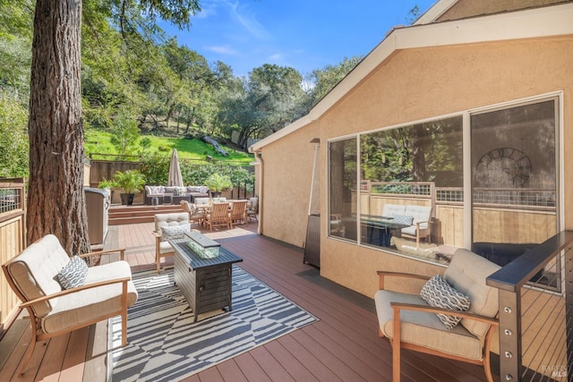 wooden terrace featuring outdoor lounge area and outdoor dining area