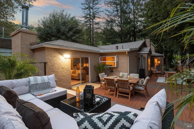 exterior space with outdoor dining area and an outdoor hangout area