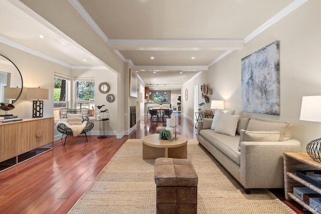 living area featuring baseboards, wood finished floors, and crown molding