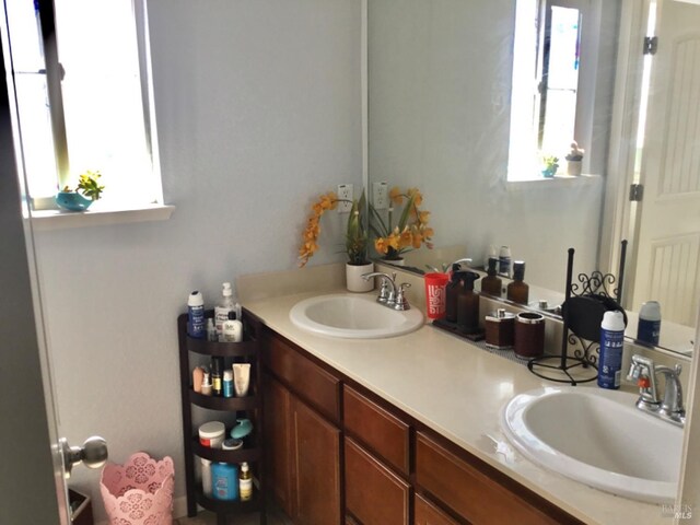 bathroom featuring double vanity and a sink