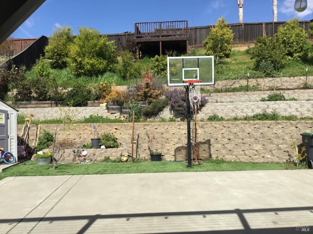 exterior space with fence and basketball court