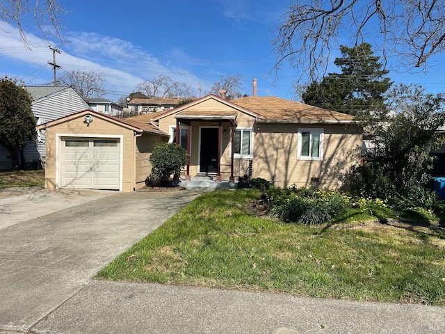 bungalow-style home with driveway, a front lawn, and a garage