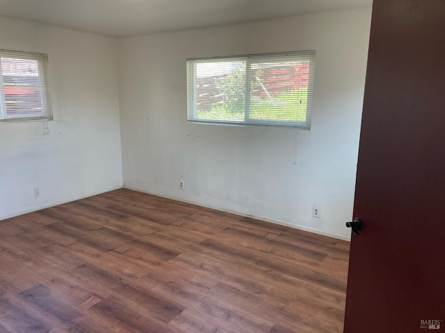 unfurnished room featuring wood finished floors