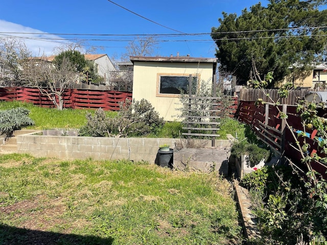 view of yard with a garden and fence