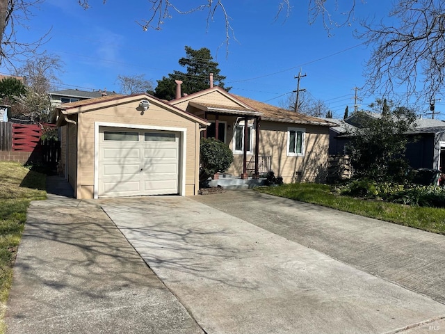 single story home featuring driveway, a garage, and fence