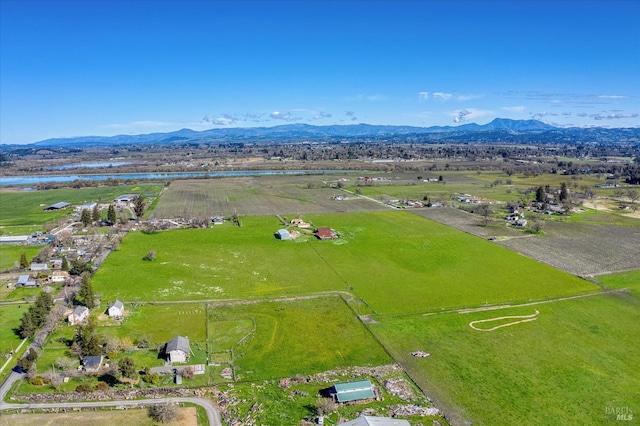 birds eye view of property featuring a mountain view and a rural view