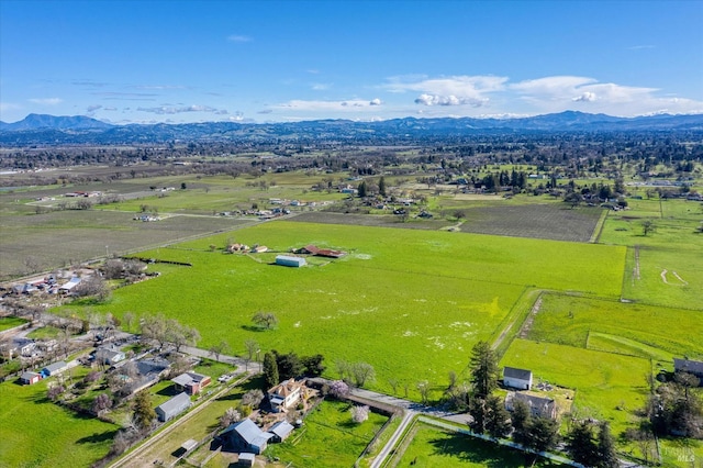 aerial view with a mountain view and a rural view