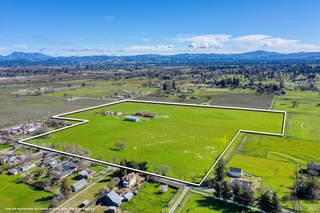 drone / aerial view with a rural view and a mountain view