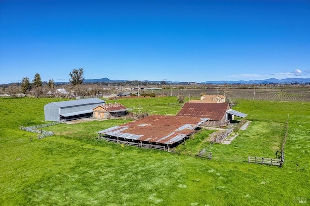 drone / aerial view featuring a rural view and a mountain view